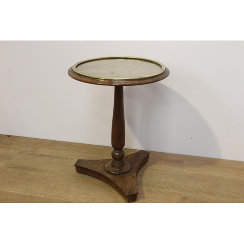 401 - Oak wine table the top with brass band enclosing a glass plate raised on tapered column and platform... 