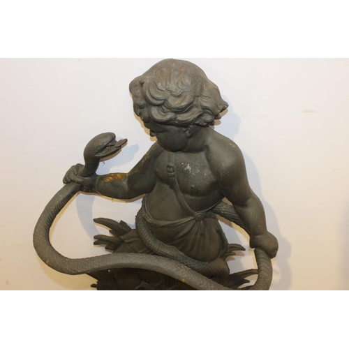 404 - Cast iron stick stand in the form of a Boy and Snake { 80cm H X 50cm W X 30cm D }.