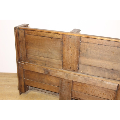 405 - 19th. C. oak two seater bench with lift up seats { 94cm H X 139cm W X 43cm D }.