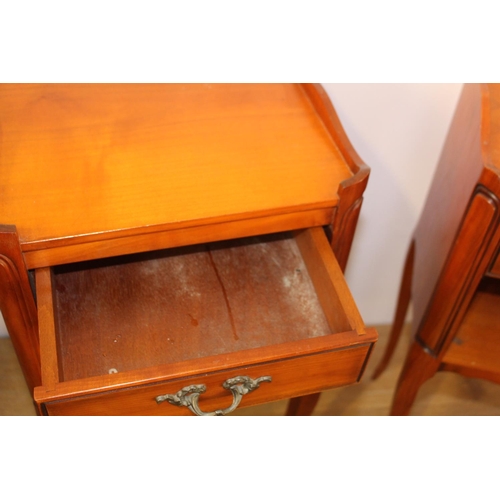 413 - Pair of walnut bedside lockers the gallery back above a single drawer and open shelf raised on shape... 