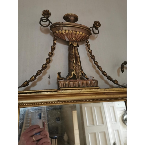 417 - Regency giltwood pier mirror decorated with swags and urn {153 cm H x 68 cm W}.