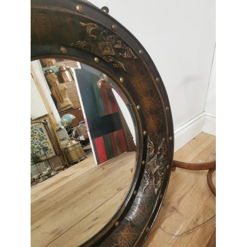 43 - Decorative wall mirror mounted in leather frame {82cm Dia.}