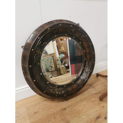 43 - Decorative wall mirror mounted in leather frame {82cm Dia.}