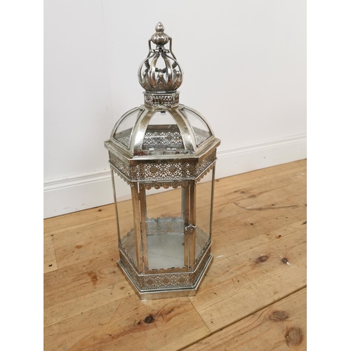 431 - Decorative silvered metal lantern with glass panel. {64 cm H x 26 cm W x 26 cm D}.