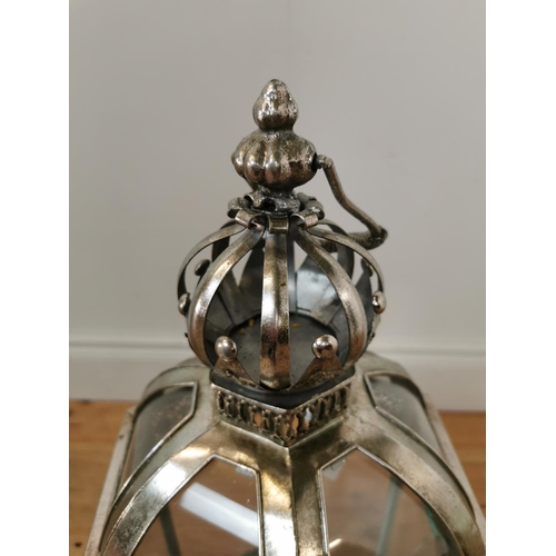 431 - Decorative silvered metal lantern with glass panel. {64 cm H x 26 cm W x 26 cm D}.