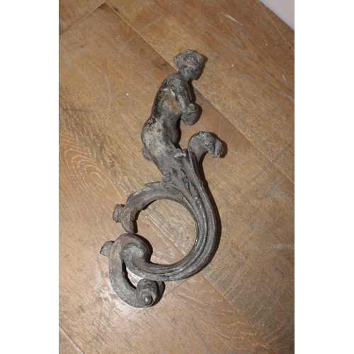 442 - 19th. C. cast iron door knocker in the form of a Lady { 38cm H X 8cm W X 14cm D }.