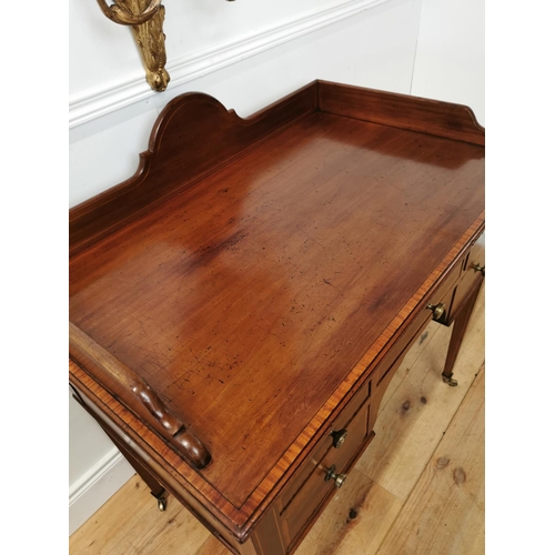 45 - 19th C. mahogany and satinwood inlaid dressing table raised on square tapered legs and brass castors... 