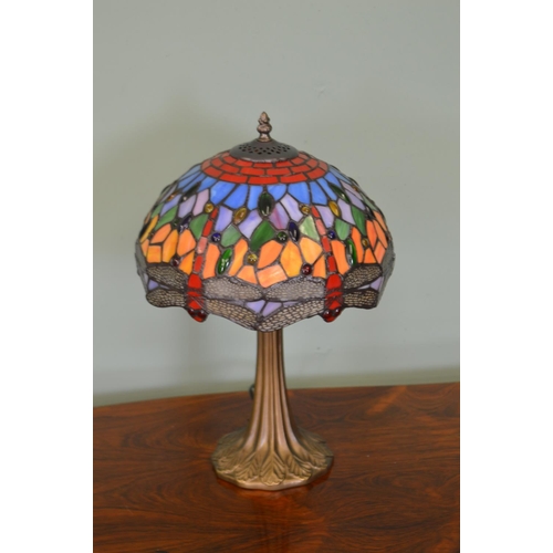 466 - Decorative table lamp on bronzed column with Tiffany style shade .  { 50cm H X 30cm Dia }.