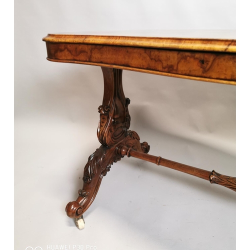 471 - 19th C. burr walnut sofa table raised on lyre supports and four outswept legs on turned stretcher {7... 