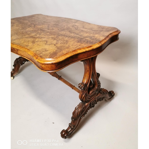 471 - 19th C. burr walnut sofa table raised on lyre supports and four outswept legs on turned stretcher {7... 