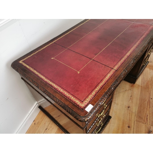 473 - 19th. C. mahogany knee hole desk the tooled leather top above a centre drawer flanked by eight short... 