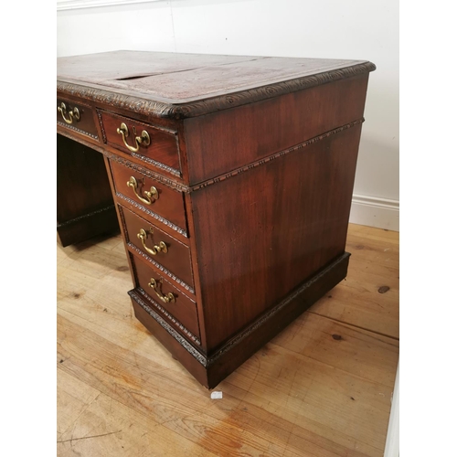 473 - 19th. C. mahogany knee hole desk the tooled leather top above a centre drawer flanked by eight short... 