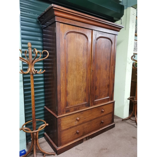 48 - 19th C. Mahogany Linen Press with two arch panel doors over two long drawers raised on plinth base {... 