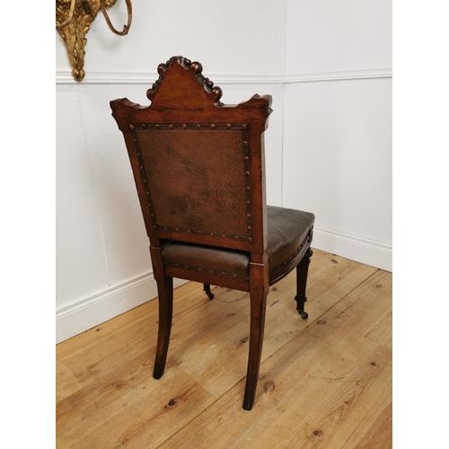 490 - Edwardian carved oak and leather upholstered side chair with amorial crest raised on tapered legs an... 