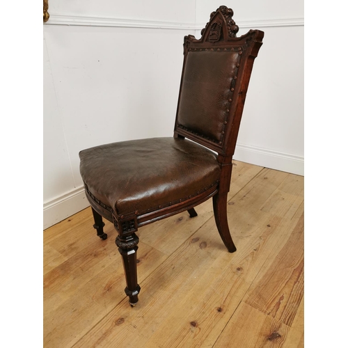 490 - Edwardian carved oak and leather upholstered side chair with amorial crest raised on tapered legs an... 