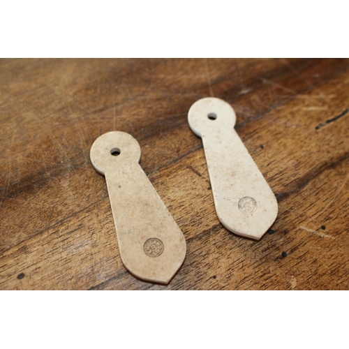 493 - Two pairs of ceramic keyhole covers { 7cm H X 2cm W }.