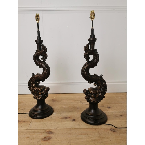 498 - Pair of decorative cast iron lamp bases in the form of mytical fish.  { 80cm H X 22cm Dia }.