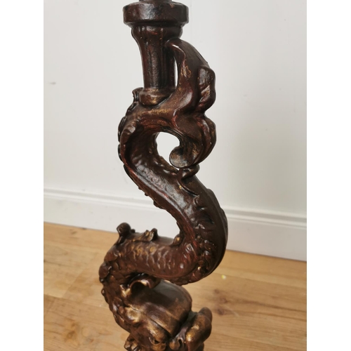 498 - Pair of decorative cast iron lamp bases in the form of mytical fish.  { 80cm H X 22cm Dia }.