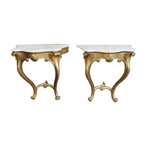 499 - Pair of 19th. C. Irish giltwood consul tables with serpentine marble tops { 90cm H X 86cm W X 48cm D... 