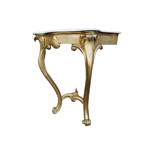 499 - Pair of 19th. C. Irish giltwood consul tables with serpentine marble tops { 90cm H X 86cm W X 48cm D... 