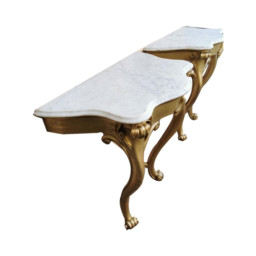 499 - Pair of 19th. C. Irish giltwood consul tables with serpentine marble tops { 90cm H X 86cm W X 48cm D... 