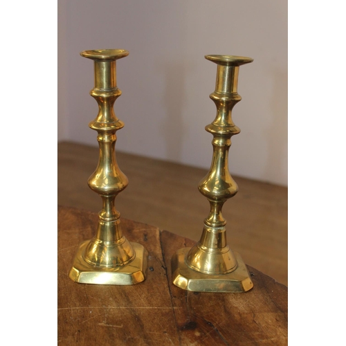 506 - Pair of 19th. C. brass candlesticks { 26cm H X 6cm Sq }.