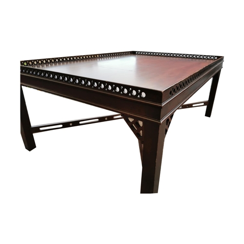 509 - Edwardian mahogany coffee table with pierced gallery back raised on sqaure legs, in the Chippendale ... 