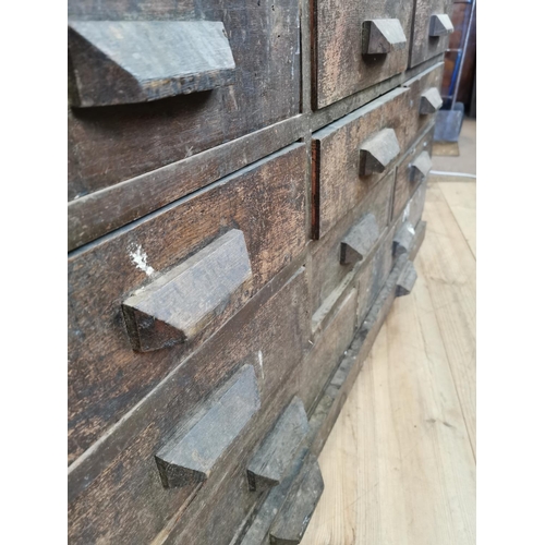 519 - Early 20th C oak bank of fifteen drawers. {100 cm H x 150 cm W x 89 cm D}.