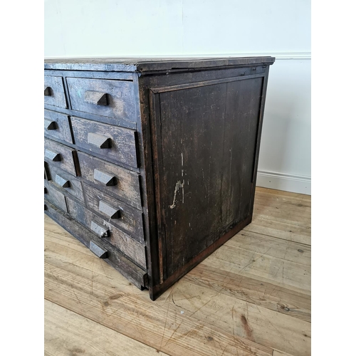 519 - Early 20th C oak bank of fifteen drawers. {100 cm H x 150 cm W x 89 cm D}.