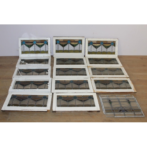 526 - Fourteen stain glass windows with cast iron frames and two unframed stain glass panes { four 40cm H ... 