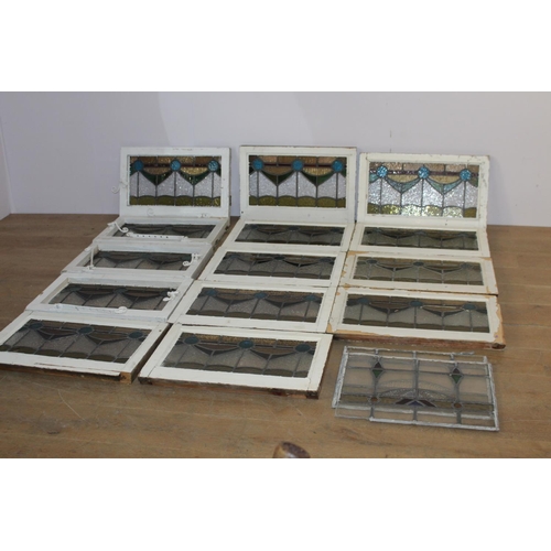 526 - Fourteen stain glass windows with cast iron frames and two unframed stain glass panes { four 40cm H ... 