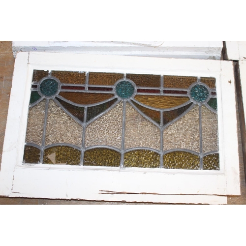 526 - Fourteen stain glass windows with cast iron frames and two unframed stain glass panes { four 40cm H ... 