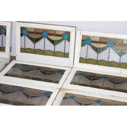 526 - Fourteen stain glass windows with cast iron frames and two unframed stain glass panes { four 40cm H ... 