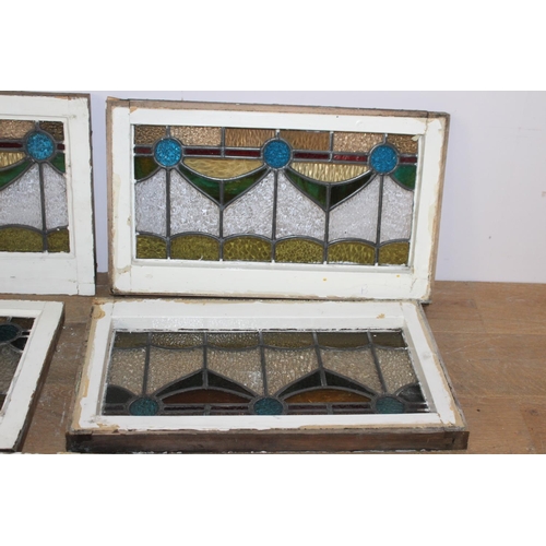 526 - Fourteen stain glass windows with cast iron frames and two unframed stain glass panes { four 40cm H ... 