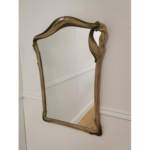 53 - Painted and gilt framed wall mirror in the Art Nouveau style {88cm H x 66cm W}