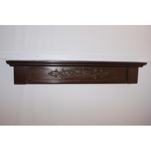 532 - Carved mahogany door head { 20cm H X 122cm W X 15cm D }.