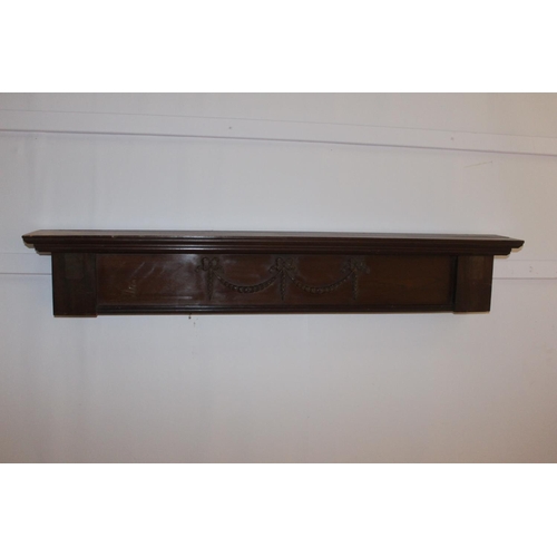 534 - Carved mahogany door head { 20cm H X 122cm W X 15cm D }.