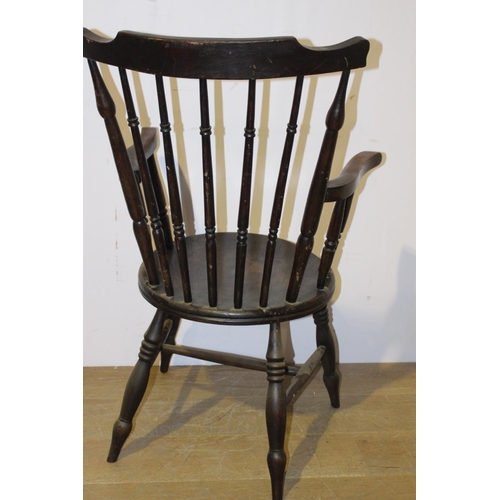 548 - Oak spindle back armchair { 102cm H X 62cm W X 45cm D }.