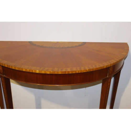 549 - Walnut veneered and satinwood demi - lune side table raised on tapered legs with spade feet in the R... 