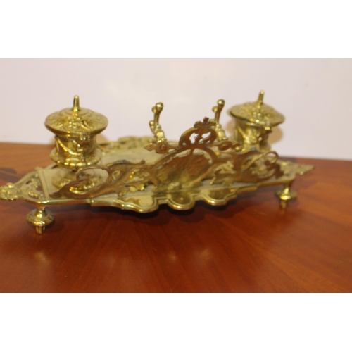 557 - Decorative brass inkwell with ceramic pots { 14cm H X 40cm W X 22cm D }.