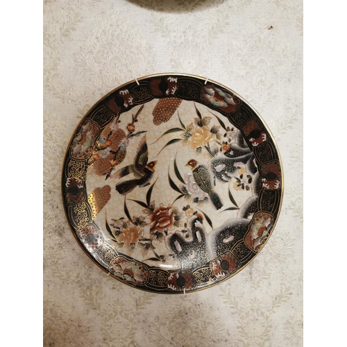 563 - Pair of decorative Oriental ceramic wall plates { 31cm Dia }.