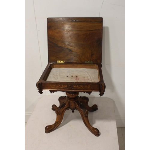 586 - 19th. C. burr walnut veneered sewing table the lift up lid enclosing a fitted interior raised on tur... 