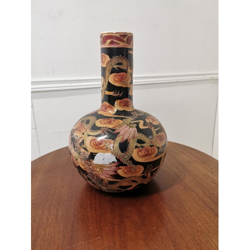 589 - Oriental ceramic onion vase decorated with flowers and dragons { 33cm H X 20cm Dia }.