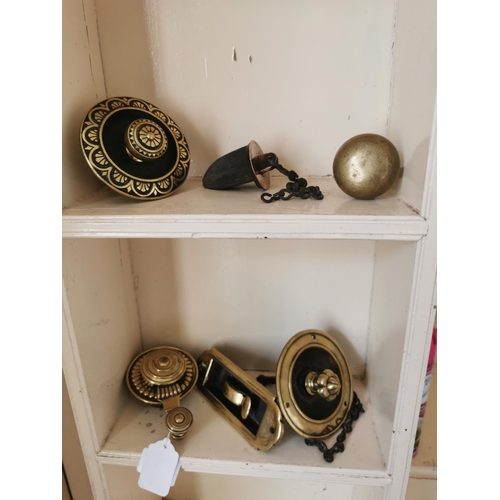 594 - Collection of four 19th. C. decorative brass room bell pulls and two brass door knobs.