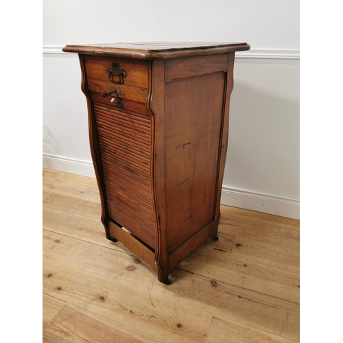6 - Early 20th. C. oak tambour cabinet with single short drawers above the tambour door enclosing shelve... 