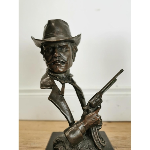 600 - Pair of bronze Cowboys on marble bases {33 cm H x 15 cm W x 15 cm D}.