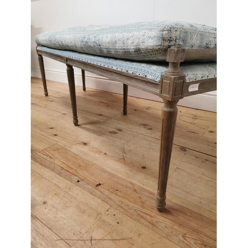 608 - Bleached oak window seat with upholstered seat and cushion raised on tapered reeded legs { 55cm H X ... 