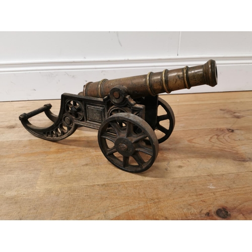 610 - 19th C. brass and cast iron desk cannon {22 cm H x 47 cm W x 14 cm D}.