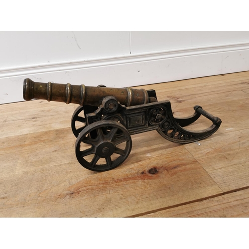 610 - 19th C. brass and cast iron desk cannon {22 cm H x 47 cm W x 14 cm D}.