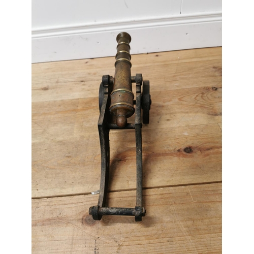 610 - 19th C. brass and cast iron desk cannon {22 cm H x 47 cm W x 14 cm D}.